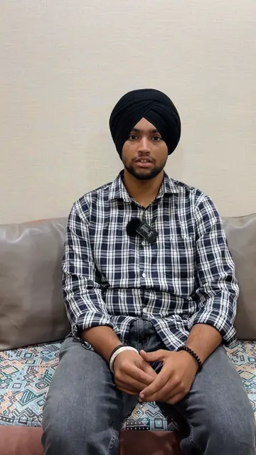 Wise Bucks student in a black turban and checked shirt, speaking to the camera