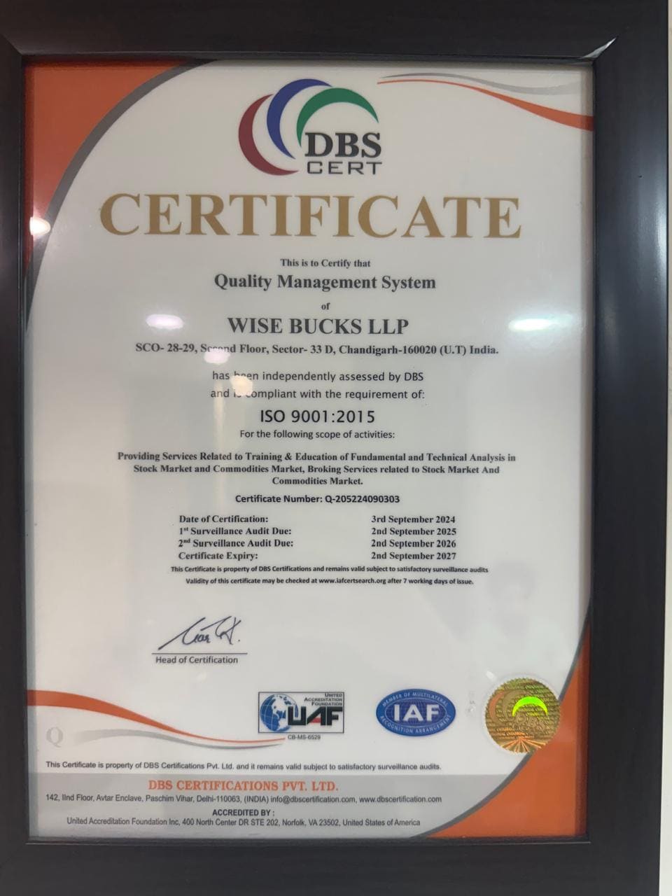 Wise Bucks LLP ISO 9001:2015 certificate, framed