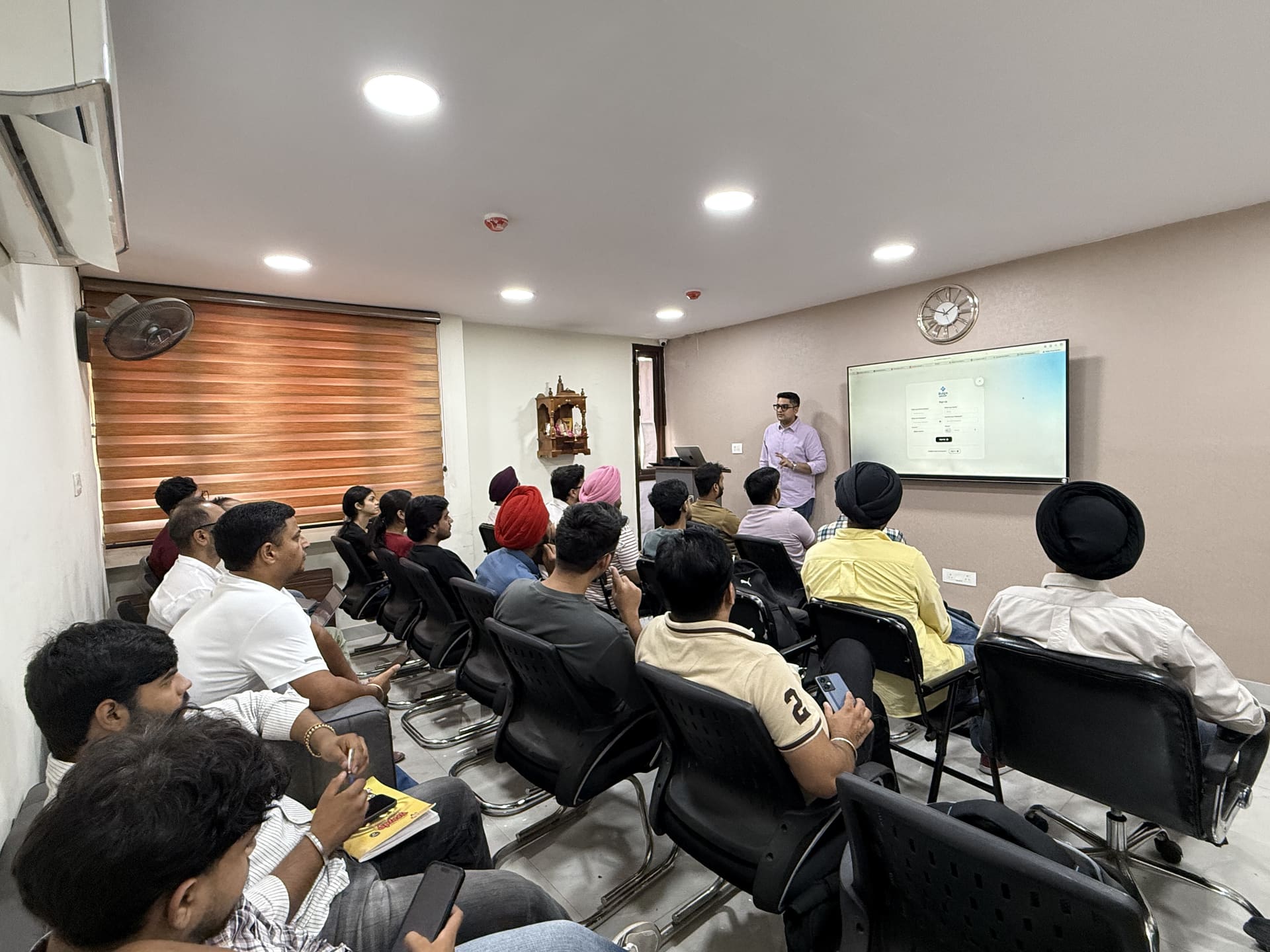A mentor presenting to a seated batch in the Wise Bucks classroom, Chandigarh